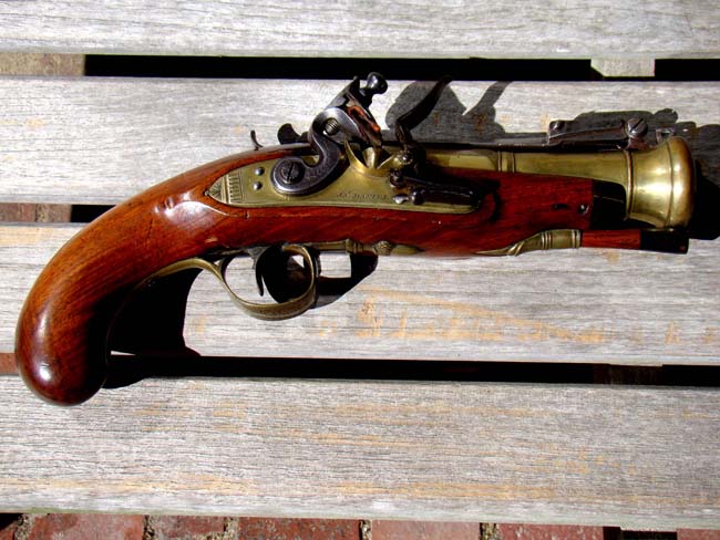 A beautiful 18th century Naval officers' flintlock brass barreled blunderbuss pistol with snap bayonet by James Daniel of Birmingham circa 1780-1790.